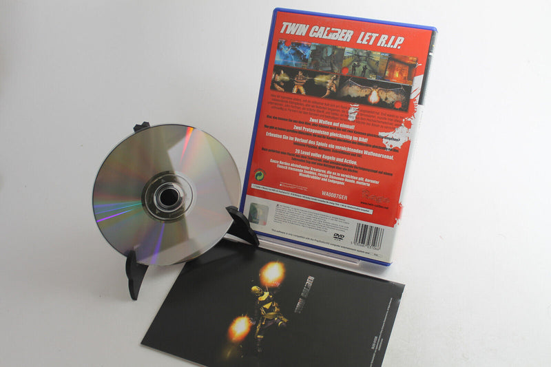 Laden Sie das Bild in Galerie -Viewer, Twin Caliber (Dt.) (Sony PlayStation 2, 2002)
